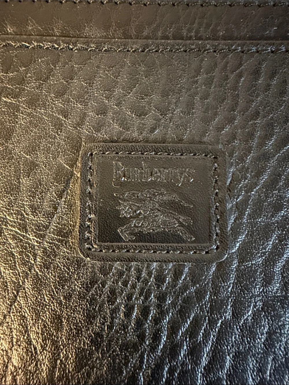 Burberry’s Wristlet or Planner